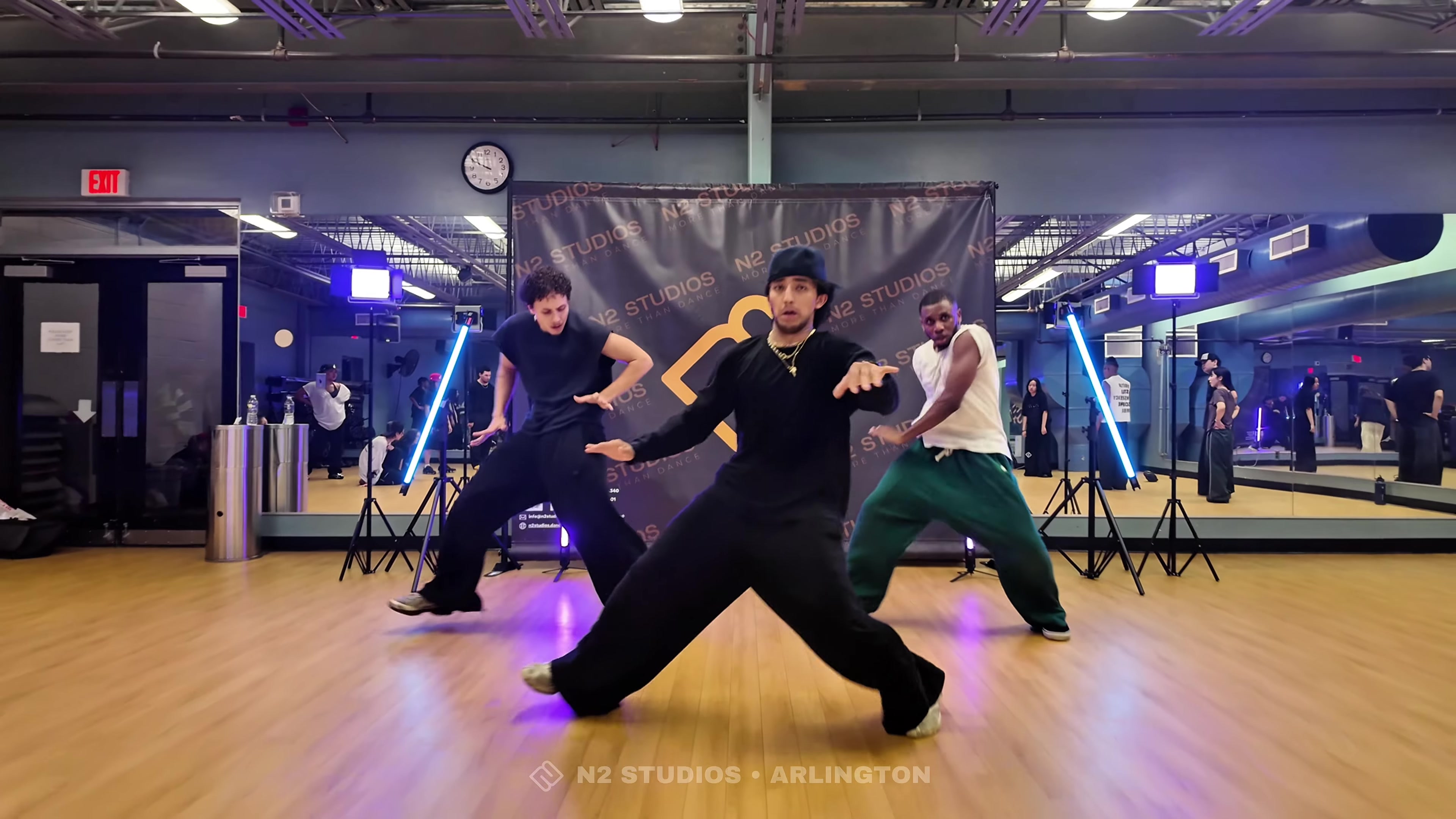Dancers performing Aaron Quini’s choreography in front of the N2 Studios backdrop.