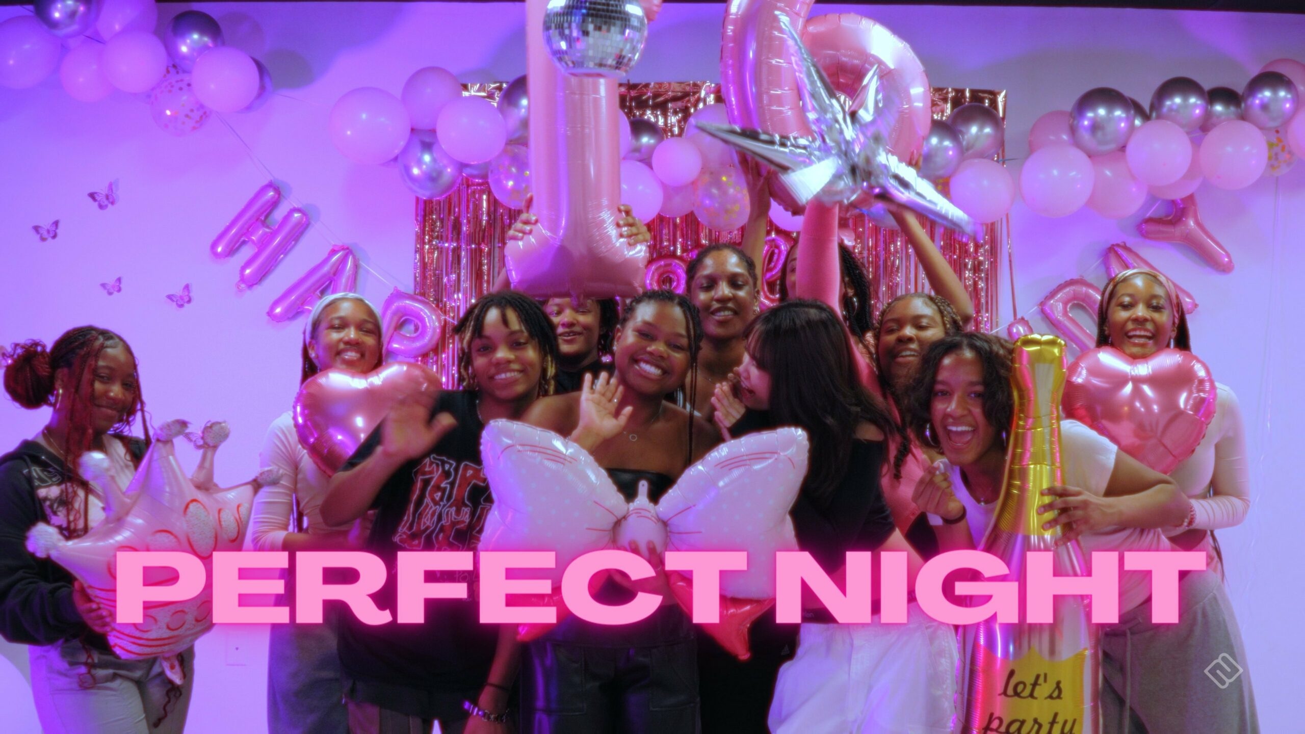 Guests celebrating with pink balloons in N2’s Perfect Night birthday music-video image.