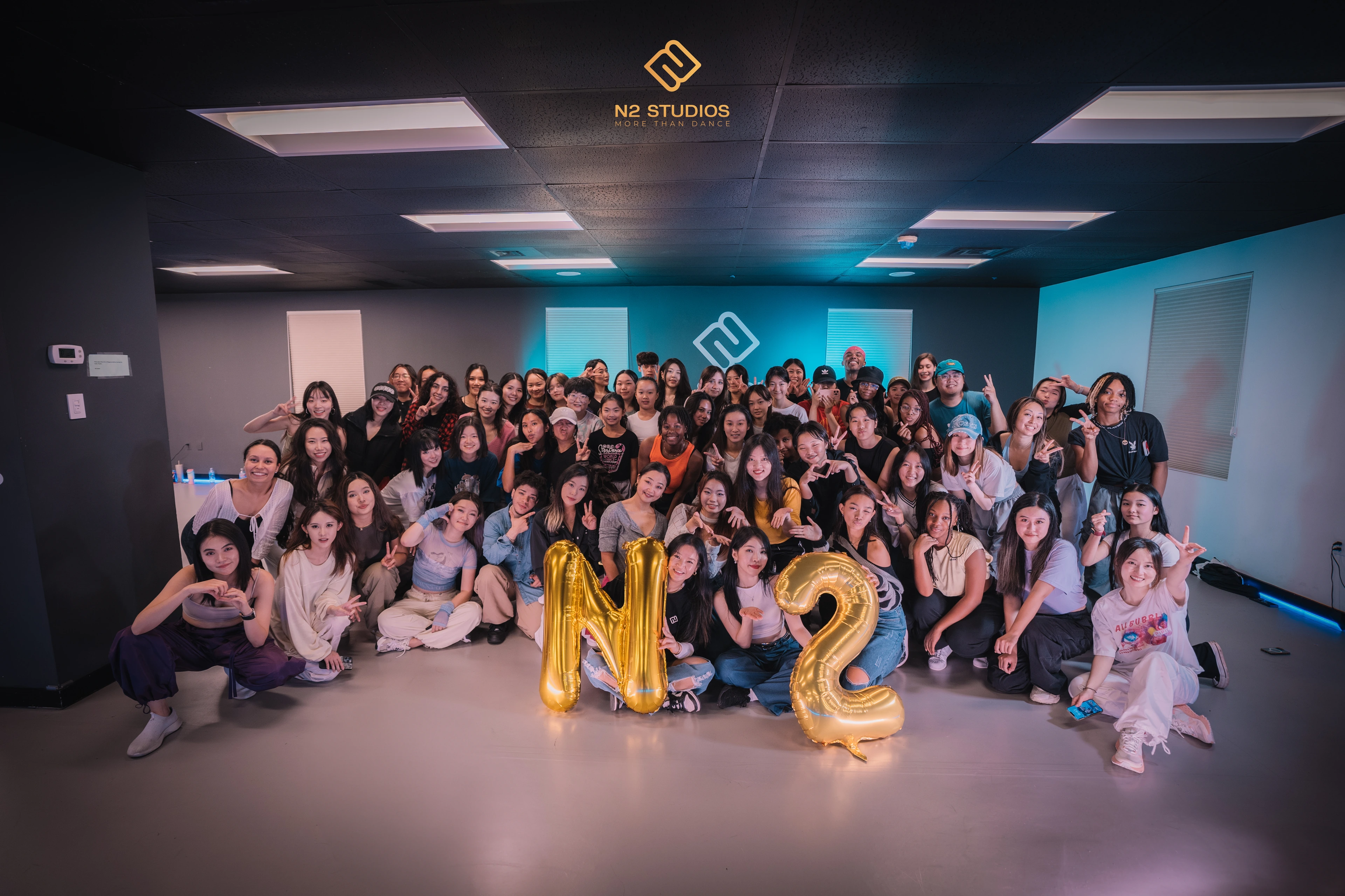 The N2 community gathered in the studio with gold N2 balloons.